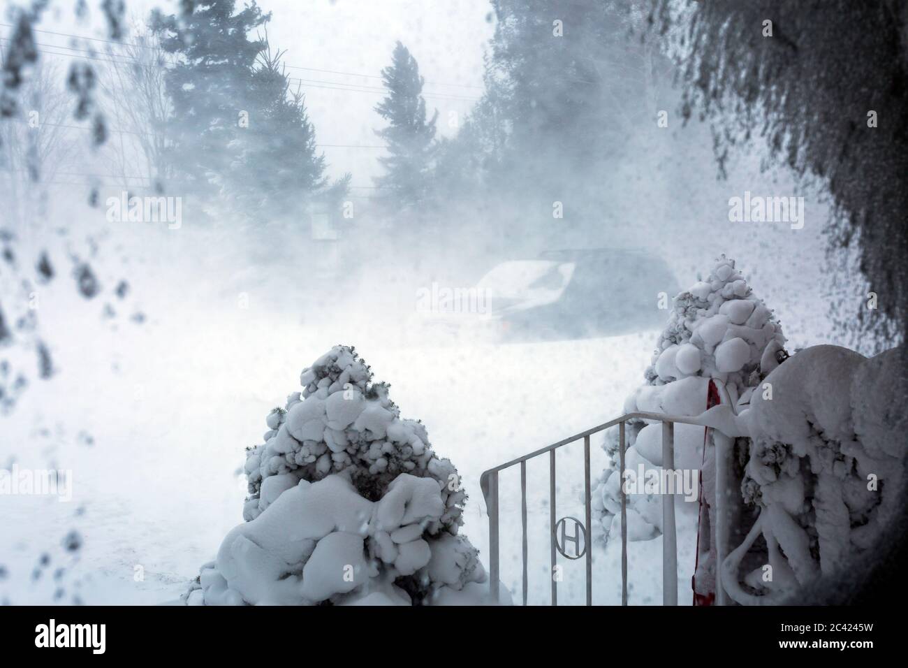 view from window showing blowing snow and strong winds Stock Photo