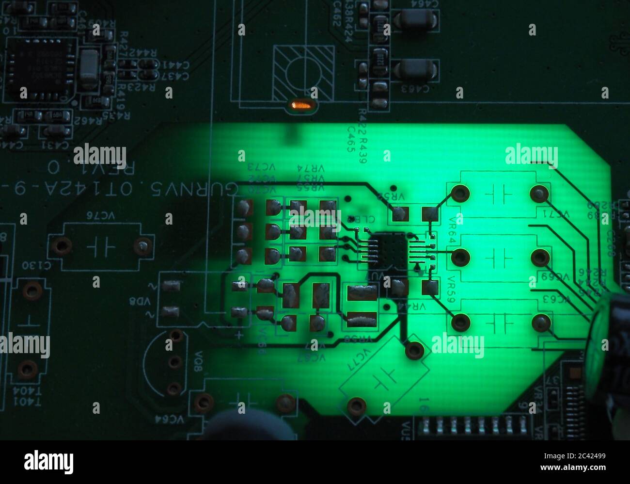 A backlit modem's mother board, removed from its plastic cover Stock Photo