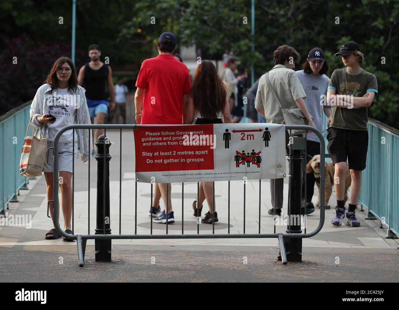 A social distancing sign on the Blue Bridge in St James's Park, London ...