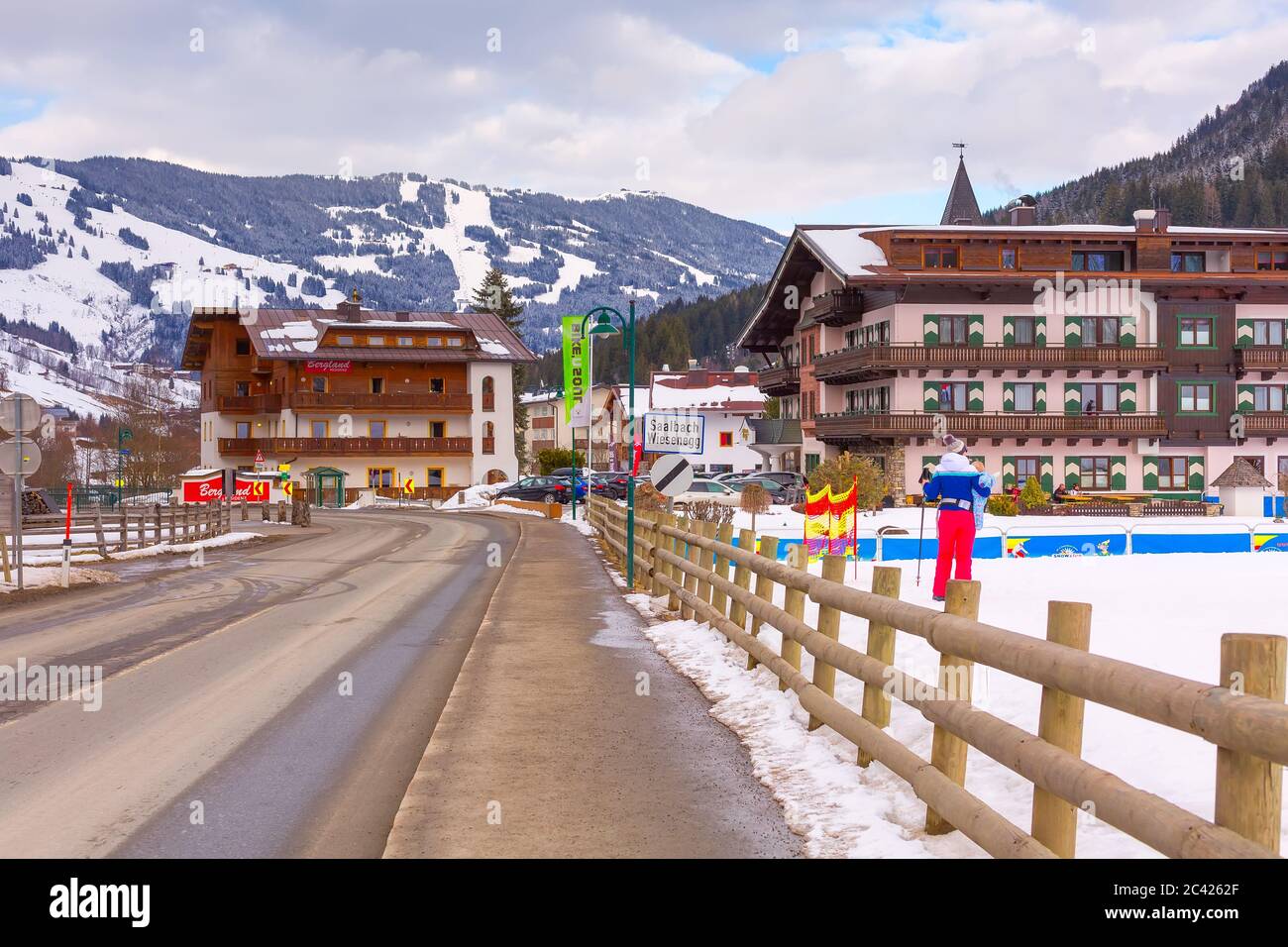 Hinterglemm, Austria - March, 4, 2020: Cityscape in the austrian resort , Alps mountains, road and houses Stock Photo