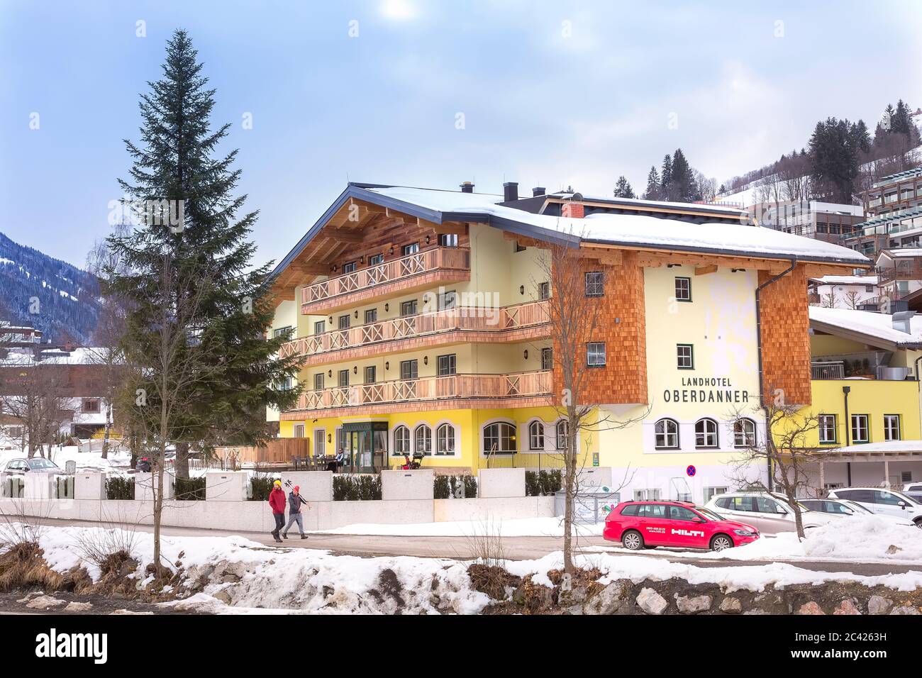 Hinterglemm, Austria - March 4, 2020: Cityscape in the austrian resort , Alps mountains, road and houses Stock Photo
