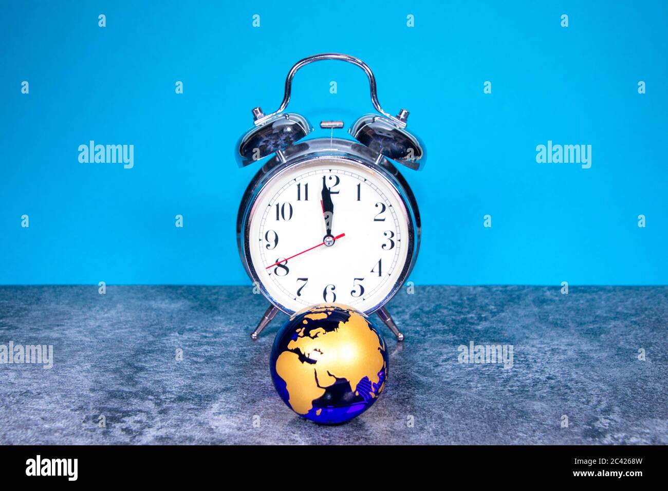 A large analogue clock counts down to a global event or depicts time running out. Stock Photo