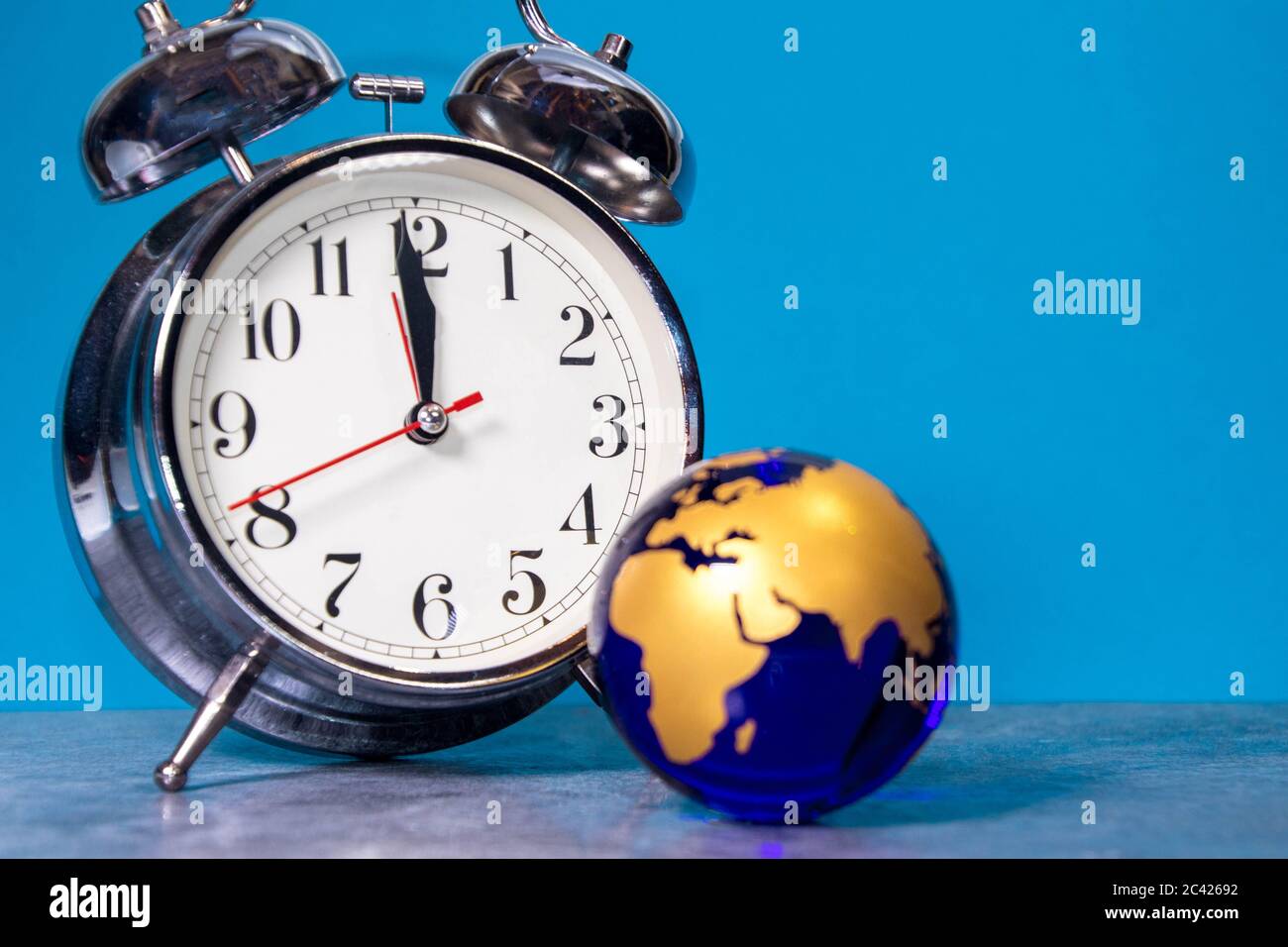 A large analogue clock counts down to a global event or depicts time running out. Stock Photo