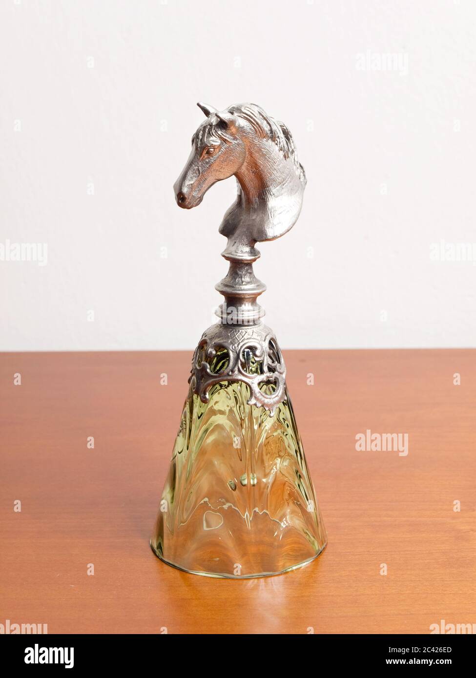 Glass bell with horse head grip Stock Photo