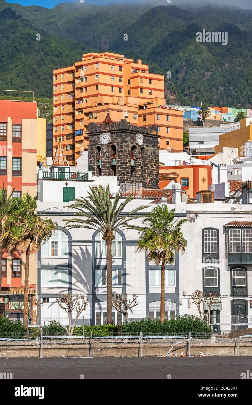 Santa Cruz de la Palma, Spain - November 12, 2019: Boulevard Avenida Maritima with the bell tower of the church Iglesia Colegial del Divino Salvador a Stock Photo