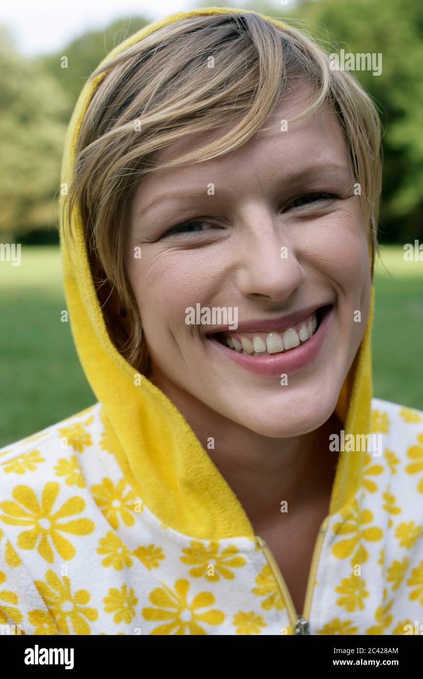 Young woman smiles outdoors in hi-res stock photography and images - Alamy