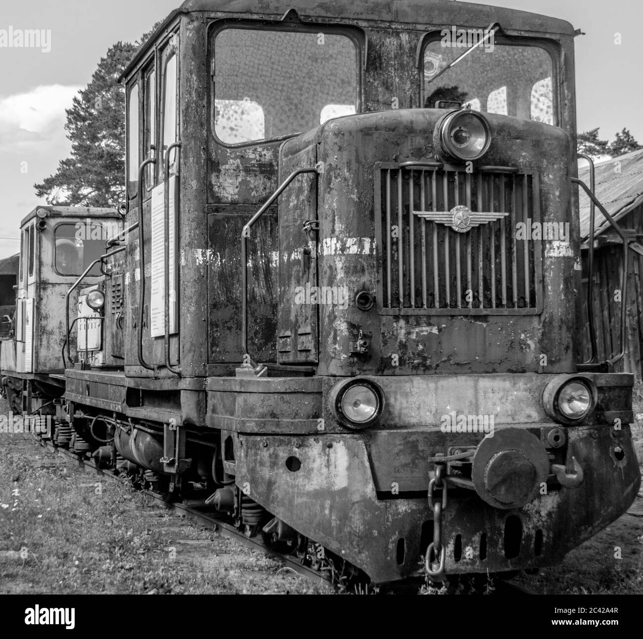 Black and white old train on railroad track. Retro steam train in museum. Stock Photo