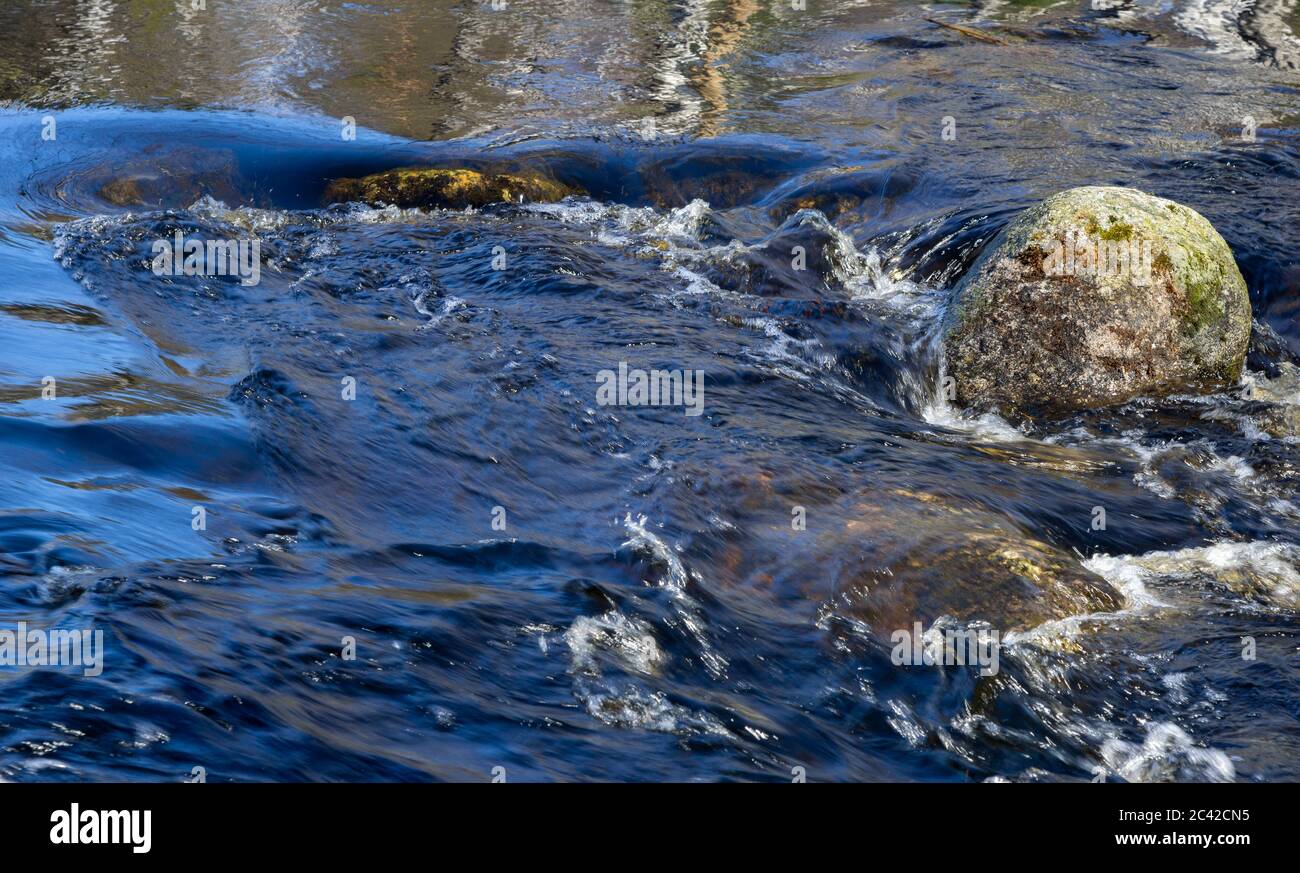 Stones in the flowing water , Finland Stock Photo