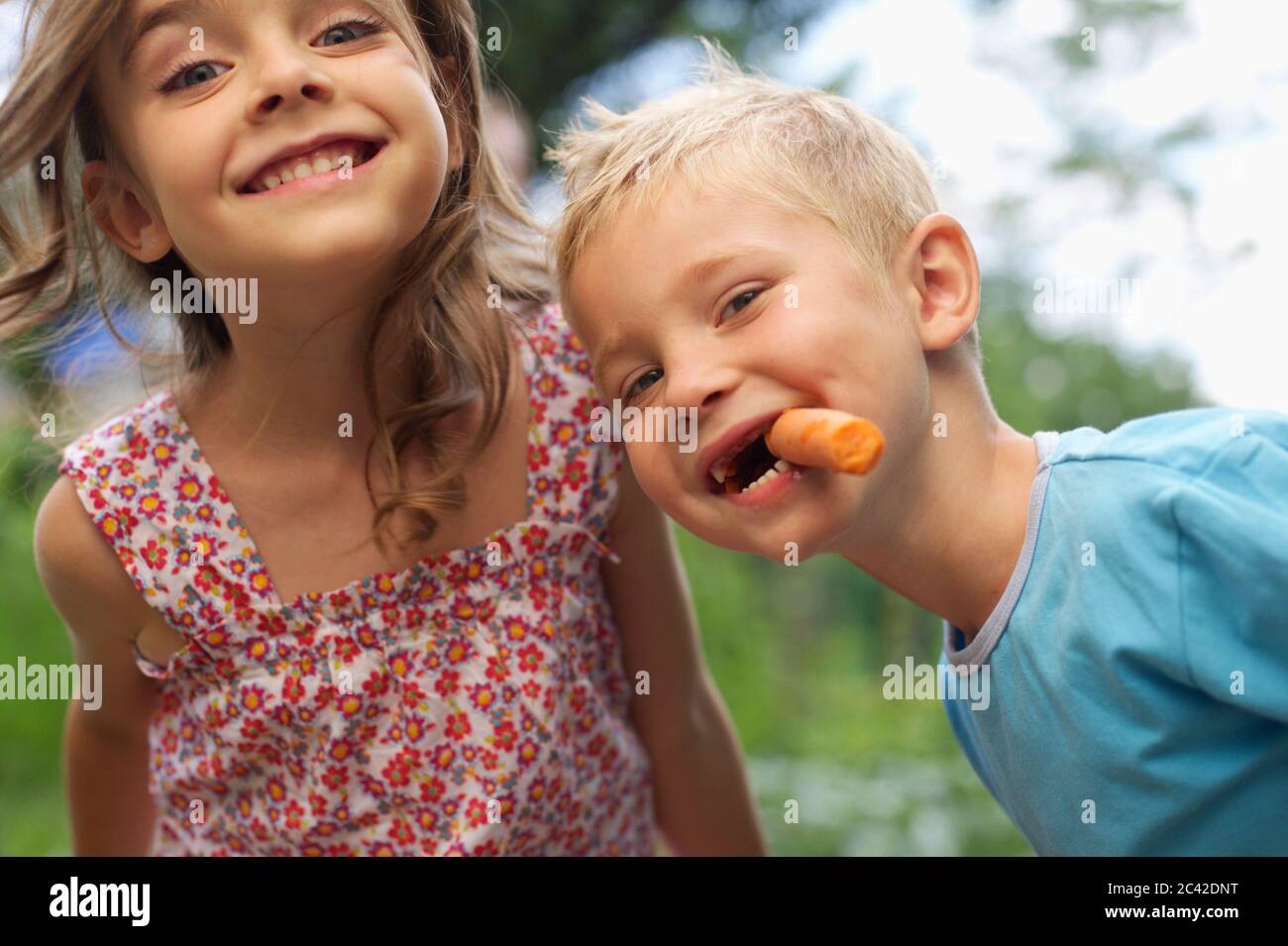 Two children laugh at the camera Stock Photo - Alamy