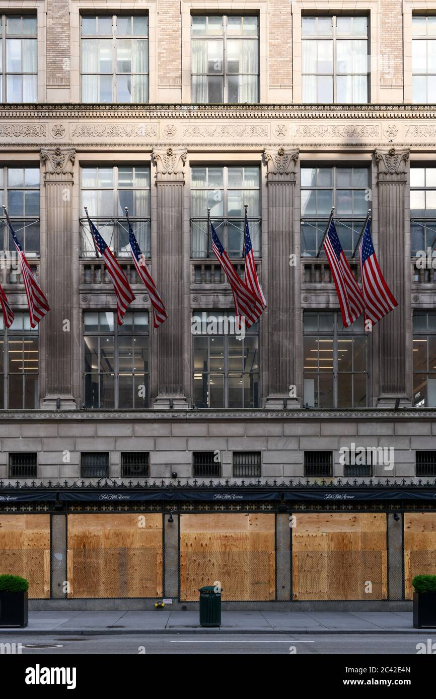 New York City, New York - June 11, 2020: Saks Fifth Avenue closed during the COVID-19 pandemic, with boarded up windows to protect against looting as Stock Photo