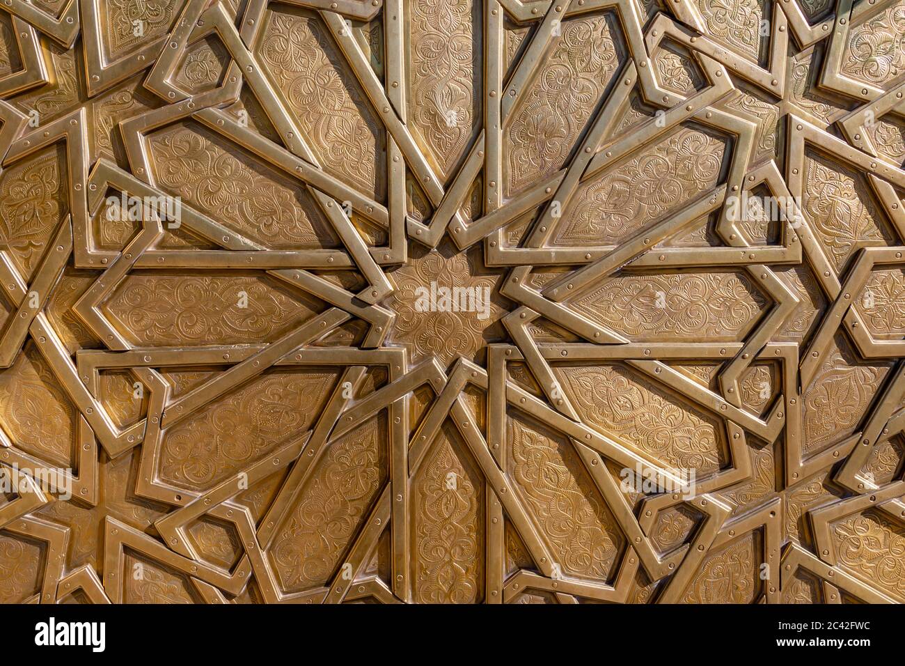 Brass door of the royal palace in Fès. The wooden gates of the wall around the royal palace between 1961 and 1968 are decorated with brass work Stock Photo