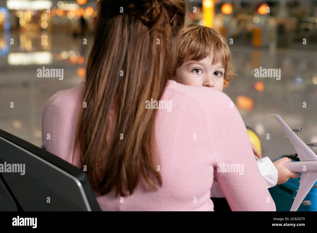 Child on lap airplane hires stock photography and images Alamy