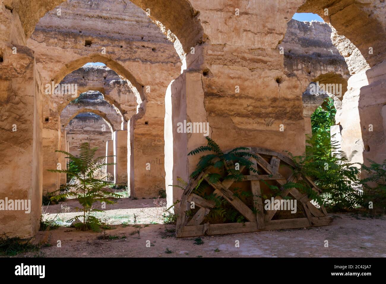 Wooden arch structure for the round arches in the stables of Heri es-Souani. The building complex belongs to the UNESCO World Heritage Site. The Heri es-Souani building complex is a UNESCO World Heritage Site in Meknes, Morocco Stock Photo
