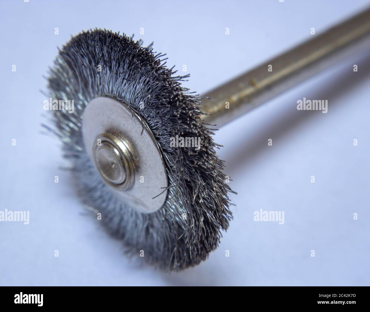 Steel brush used with rotary tools to clean metal surfaces Stock Photo