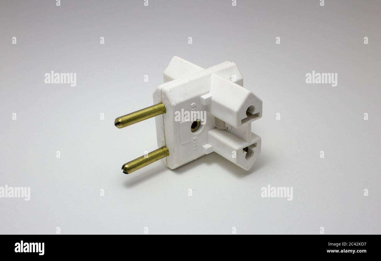 Travel power adapter made of plastic and metal for different electrical socket standards Stock