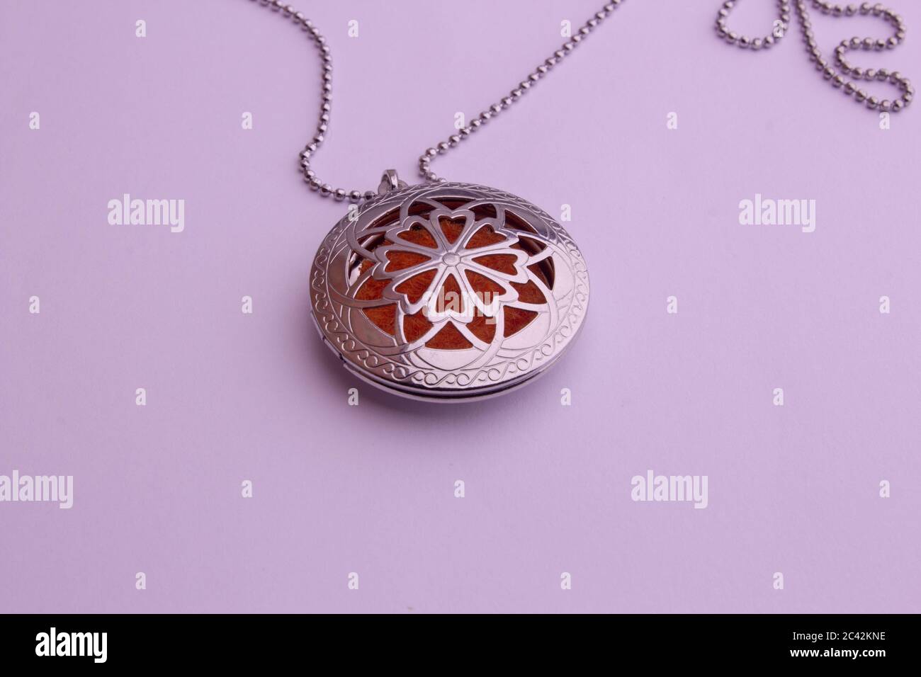 Essential oil infuser used as pendant of a necklace Stock Photo Alamy