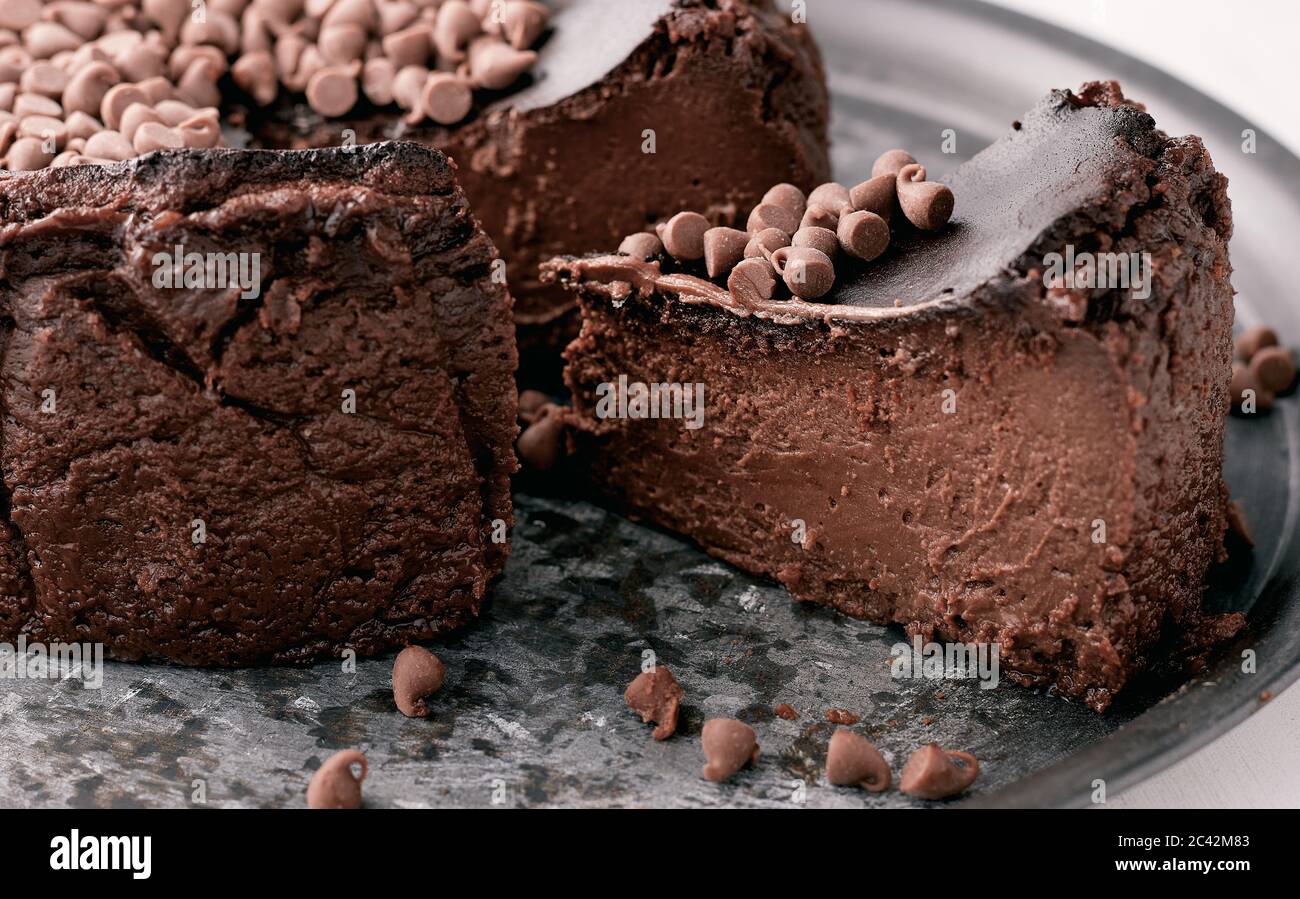 A Piece Of A Chocolate Basque Burnt Cheesecake Close Up Stock Photo Alamy