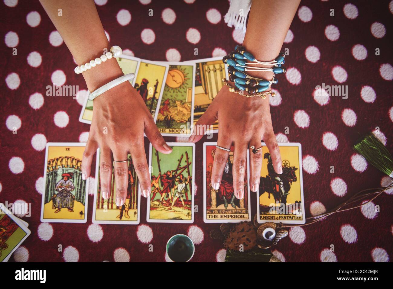 Tarot cards reading divination Psychic readings and clairvoyance concept / fortune teller hands , and Horoscopes Stock Photo