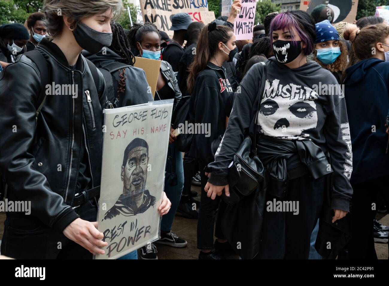 Protester holds placard with the words 'George Floyd Rest in Power' and his portrait  during the protest assembly in solidarity to BLM movement. Stock Photo