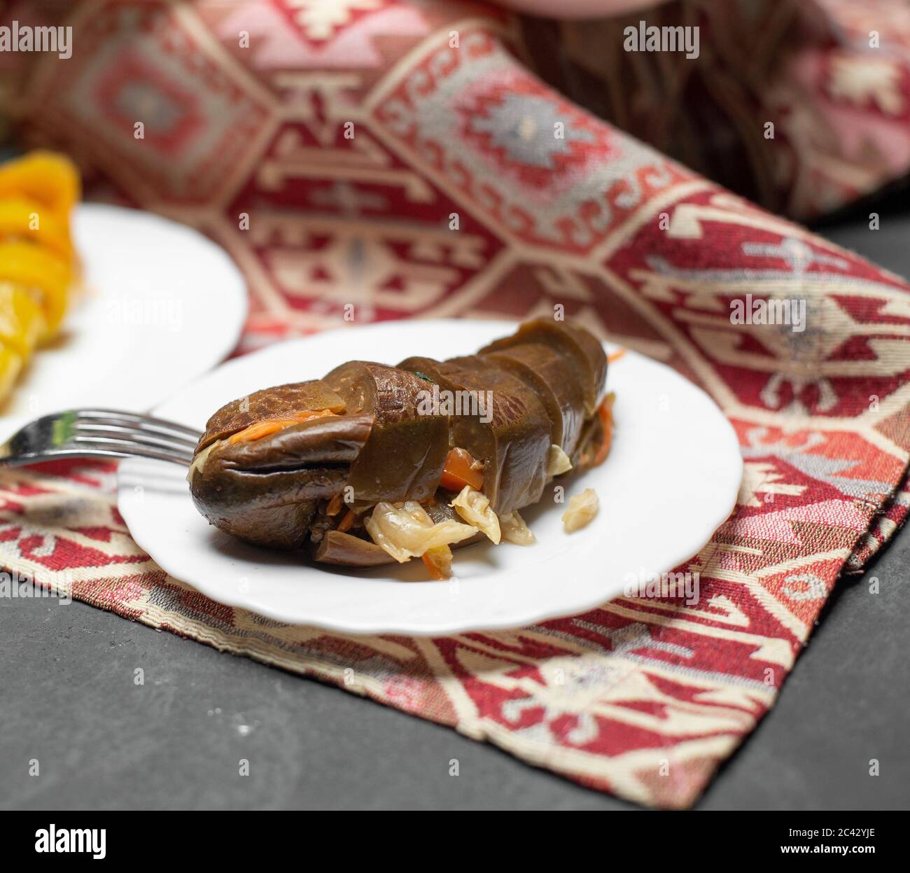 Marinated eggplant salad in white plate Stock Photo Alamy