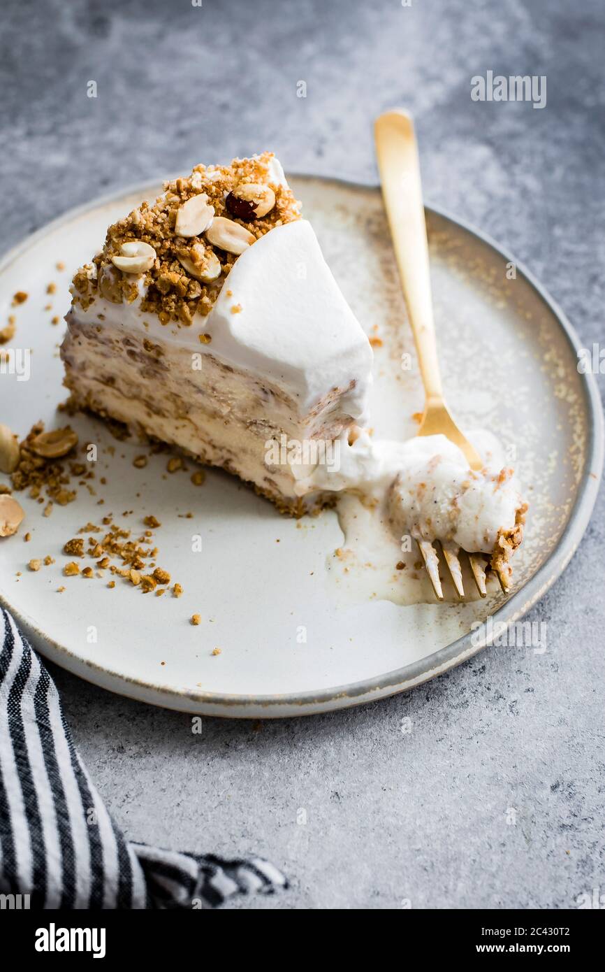 Vanilla streusel ice cream cake on a plate. Stock Photo