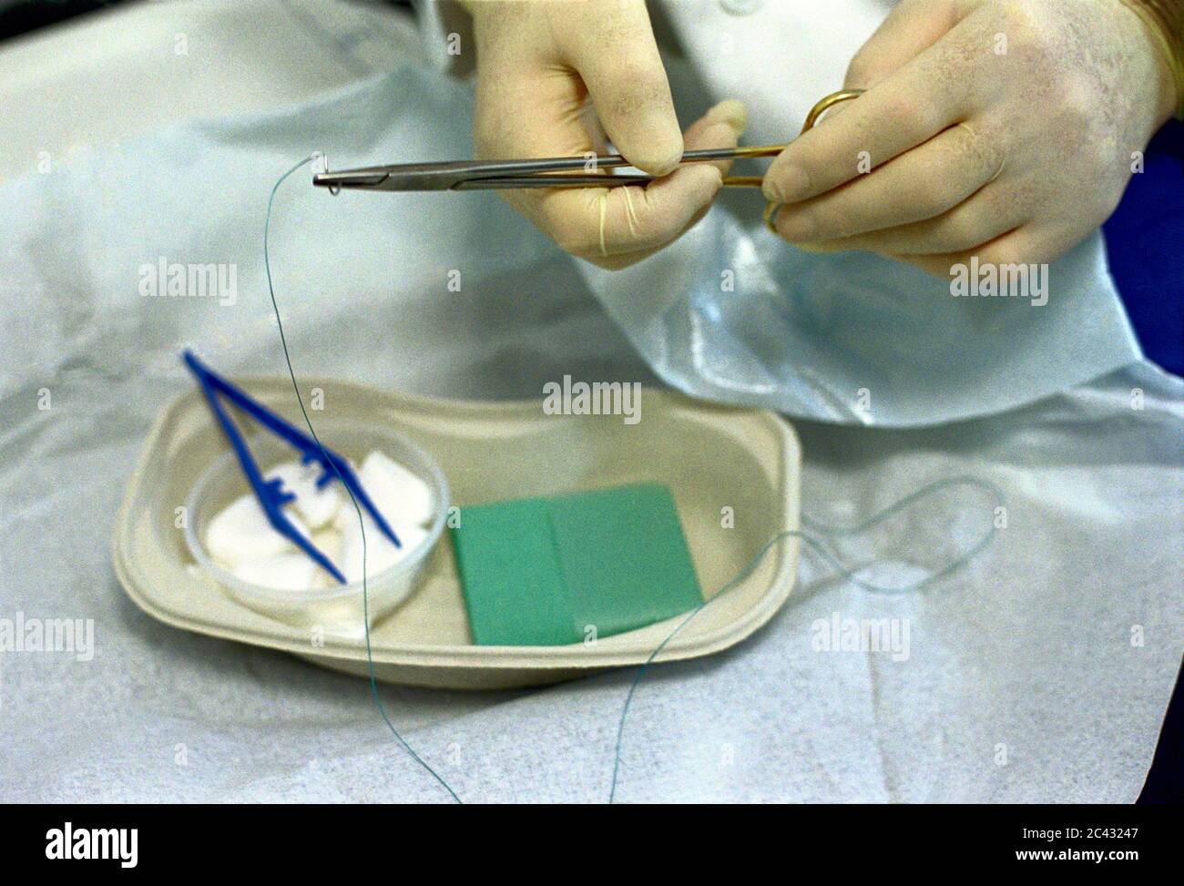 Doctor with surgical sewing kit (detail) - hospital Stock Photo - Alamy