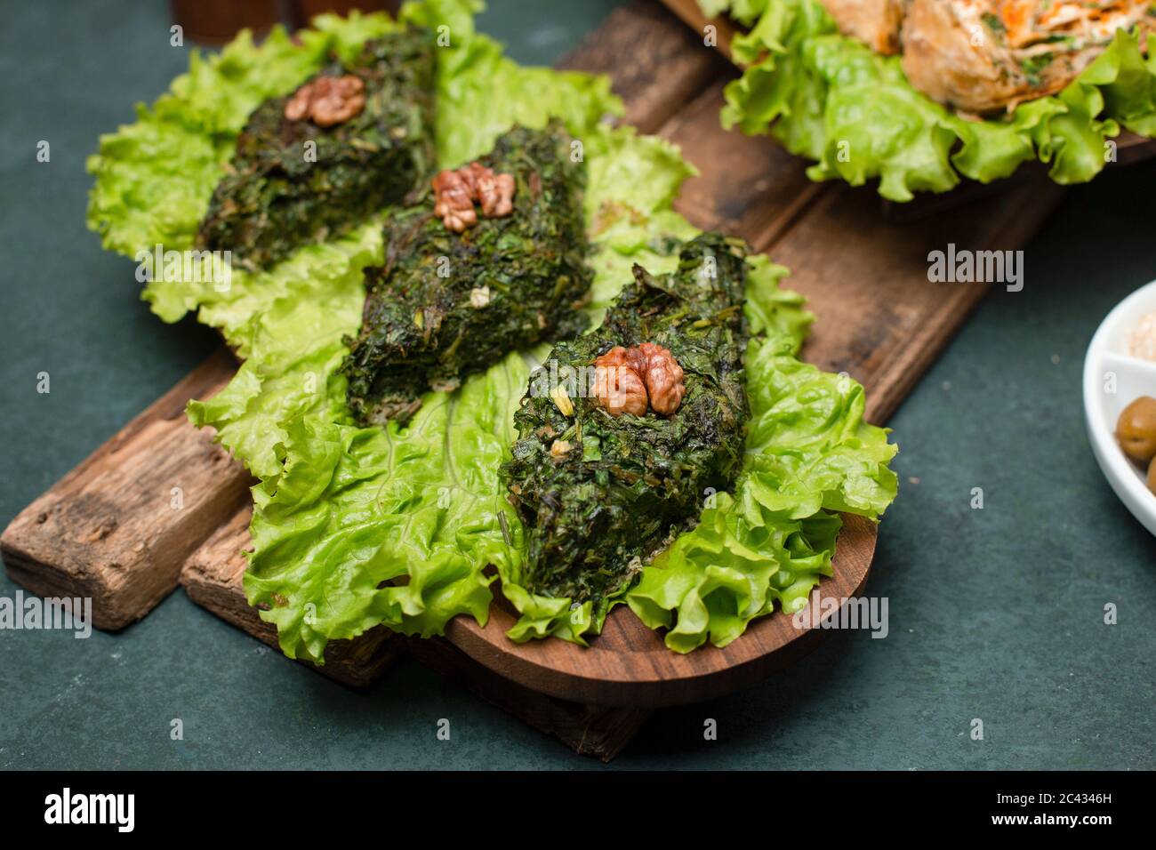 Green herbal omlette on a lettuce leaf Stock Photo