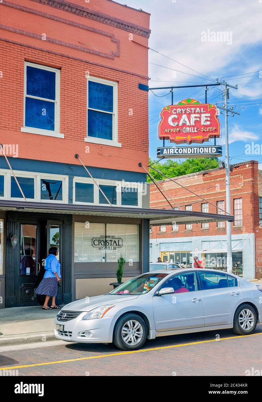 A woman enters the Crystal Grill, Aug. 10, 2016, in Greenwood, Mississippi. The family-owned restaurant is a local favorite. Stock Photo