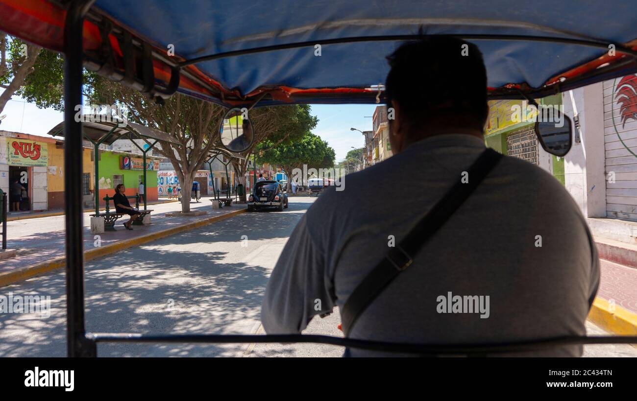 Catacaos, Piura / Peru - April 6 2019: Photo taken from the inside of a mototaxi in movement touring the town of Catacaos Stock Photo