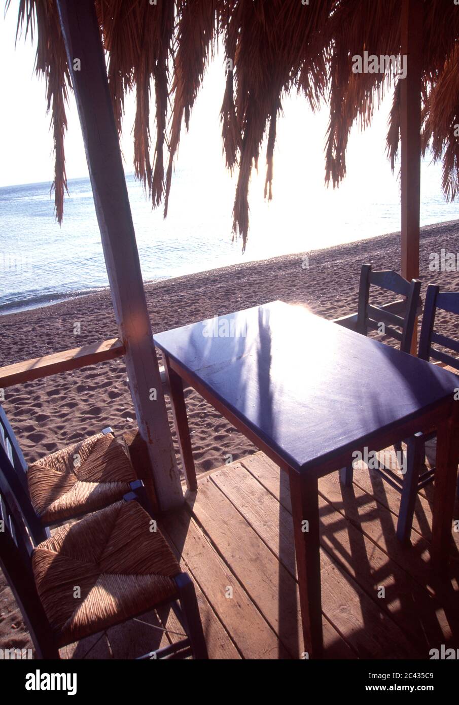 Table and chairs - Beach - Skala Eressou - Lesbos - Greece Stock Photo