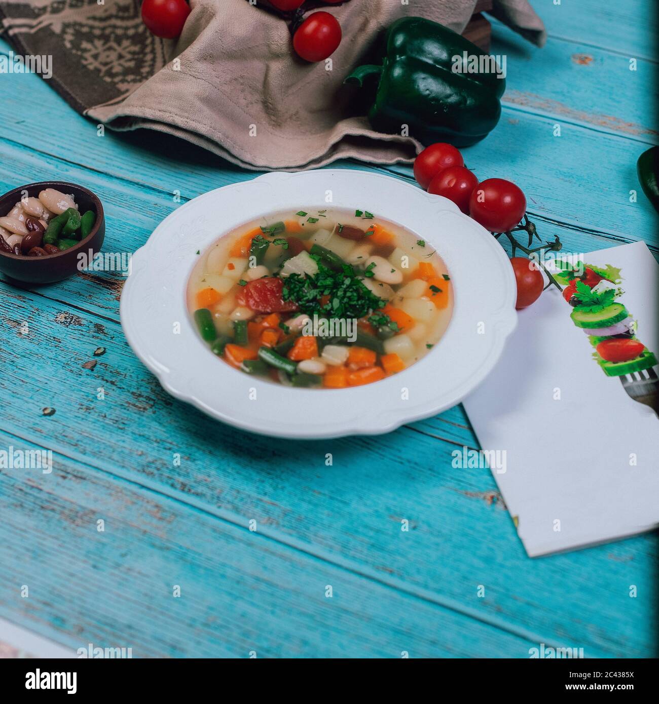 Vegetable soup served with minced herbs in white plate Stock Photo Alamy