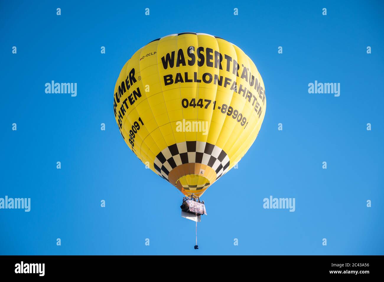 Cloppenburg, Germany. 23rd June, 2020. The band 'Crackerjacks' rides with a hot-air balloon over Cloppenburg and gives a balloon concert. Credit: Mohssen Assanimoghaddam/dpa/Alamy Live News Stock Photo