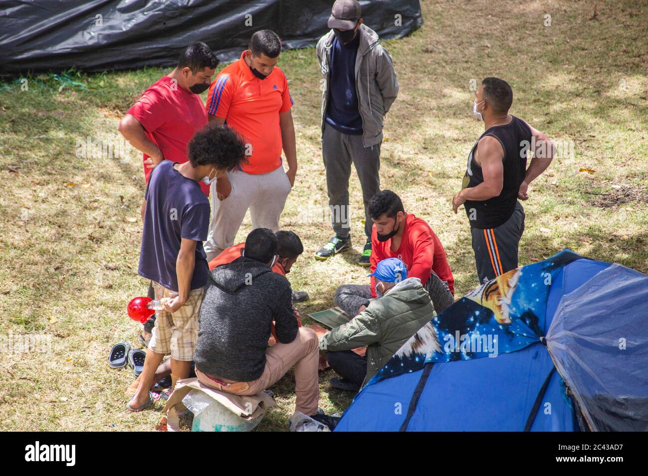 People playing in the makeshift camp north of the city of Bogotá where Venezuelans live due to the pandemic in Colombia Stock Photo