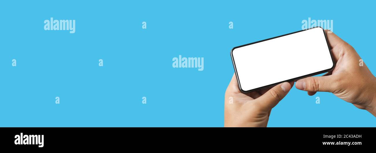 man using  Mock up a Cell Phone With Blank Screen space banner Stock Photo
