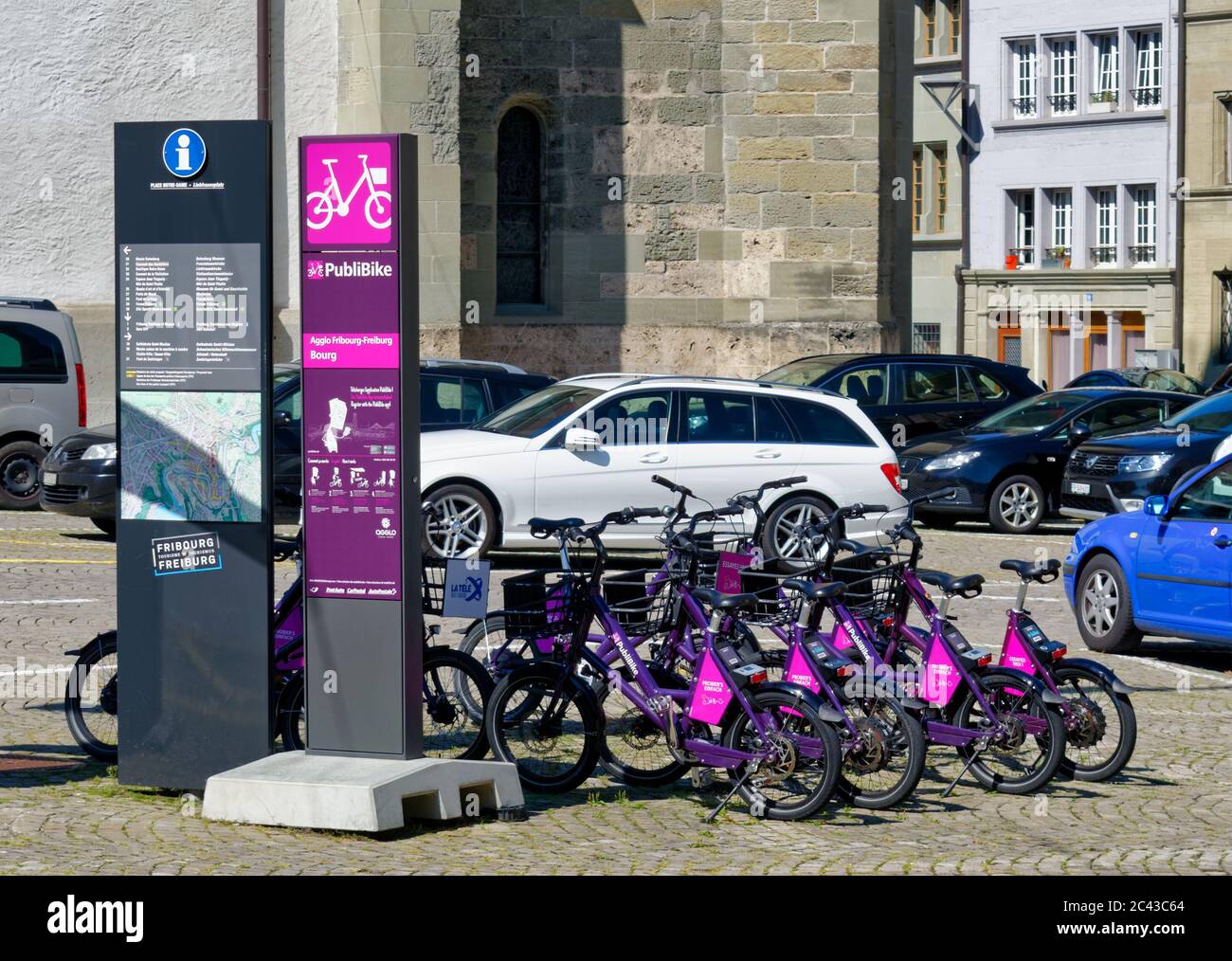 The PubliBike station, part of the Swiss bike-sharing system, is surrounded  by cars on a parking lot in center of Fribourg (Freiburg), Switzerland  Stock Photo - Alamy
