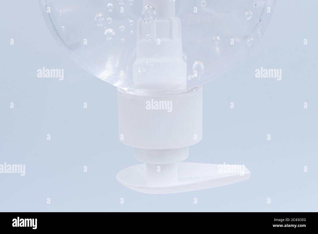 Close up. Clear hand sanitizer in a clear pump bottle isolated on a white background. Hand sanitizer is used for killing germs, bacteria and viruses. Stock Photo