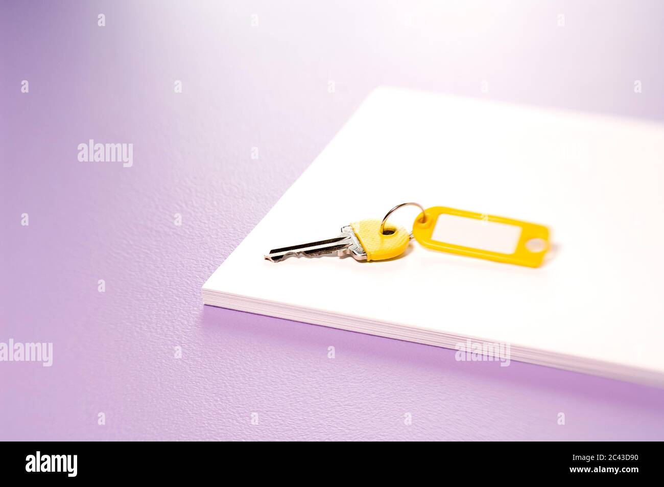 Keys on a writing pad Stock Photo - Alamy