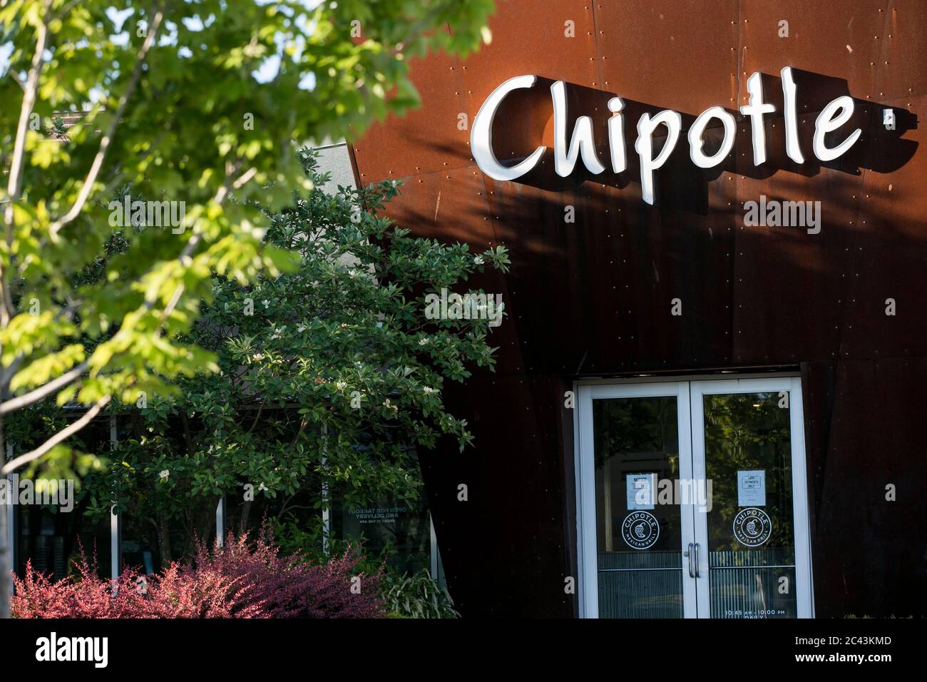 A logo sign outside of a Chipotle restaurant location in Bowie, Maryland on June 8, 2020. Stock Photo