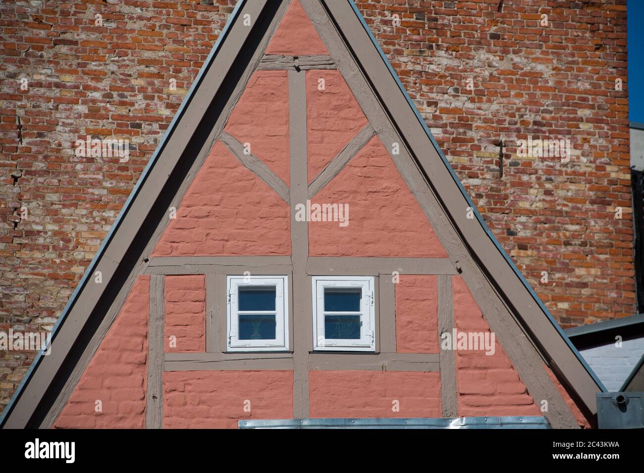 15 June 2020, Mecklenburg-Western Pomerania, Stralsund: Half-timbered houses in the monastery courtyard of the former Franciscan monastery St. Johannis (Johanniskloster) in the old town of Stralsund. The Hanseatic city of Stralsund, first mentioned in 1234, is one of the tourist magnets in Mecklenburg-Vorpommern because of the more than 500 listed buildings, most of which have been extensively restored in recent years with the trustee redevelopment company Stadterneuerungsgesellschaft Stralsund mbH (SES). In June 2002, the medieval old town centre of Stralsund was included in the UNESCO list o Stock Photo