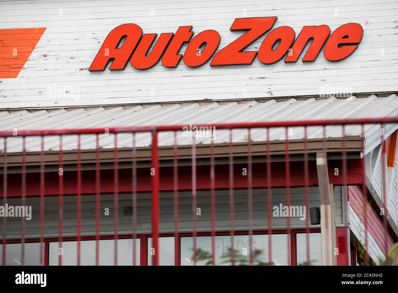 A logo sign outside of a AutoZone retail store location in Frederick