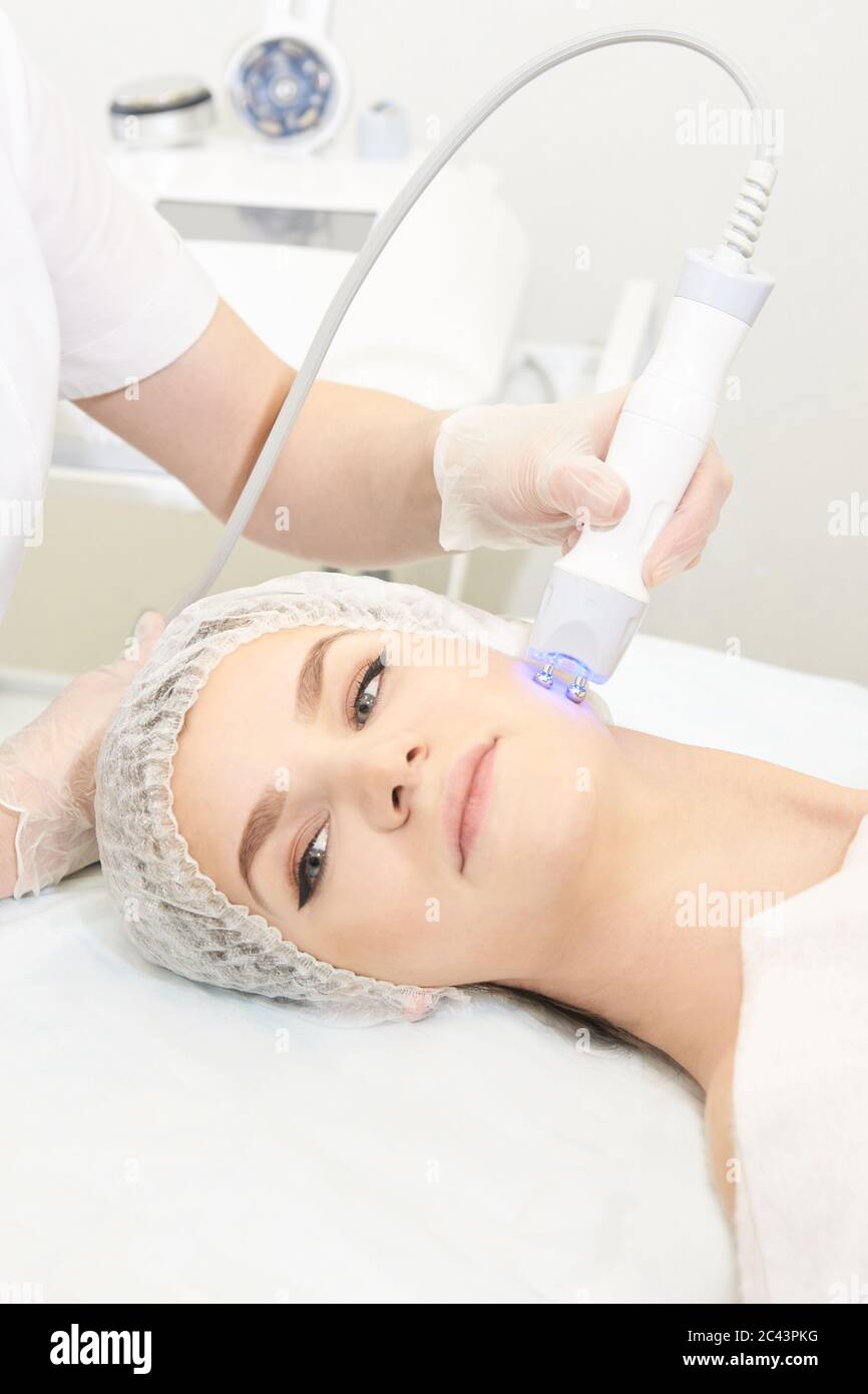 Dermatology treatment in cosmetology clinic. Woman and doctor. Skin procedure Stock Photo