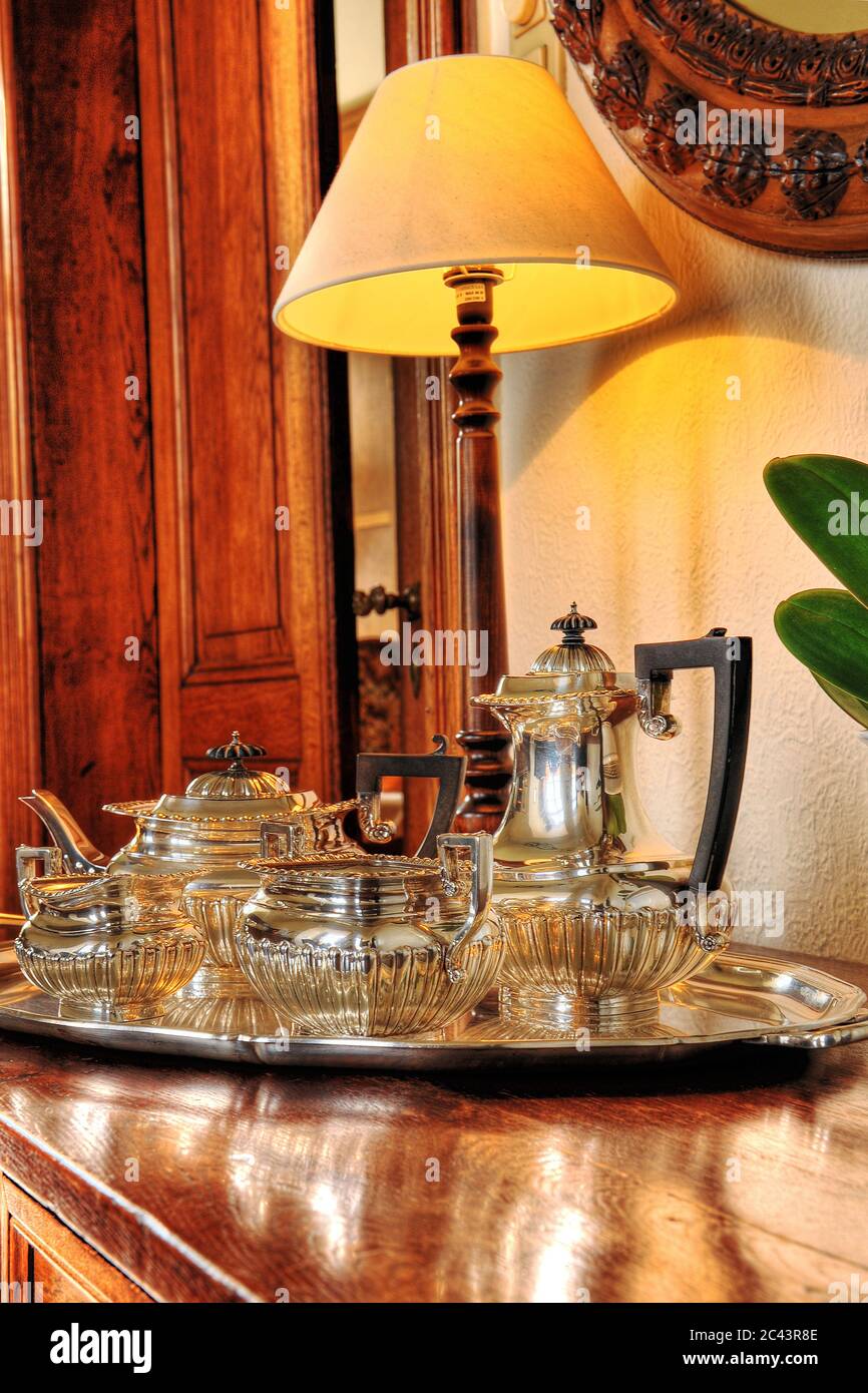 Silver tea service on a chest of drawers Stock Photo Alamy