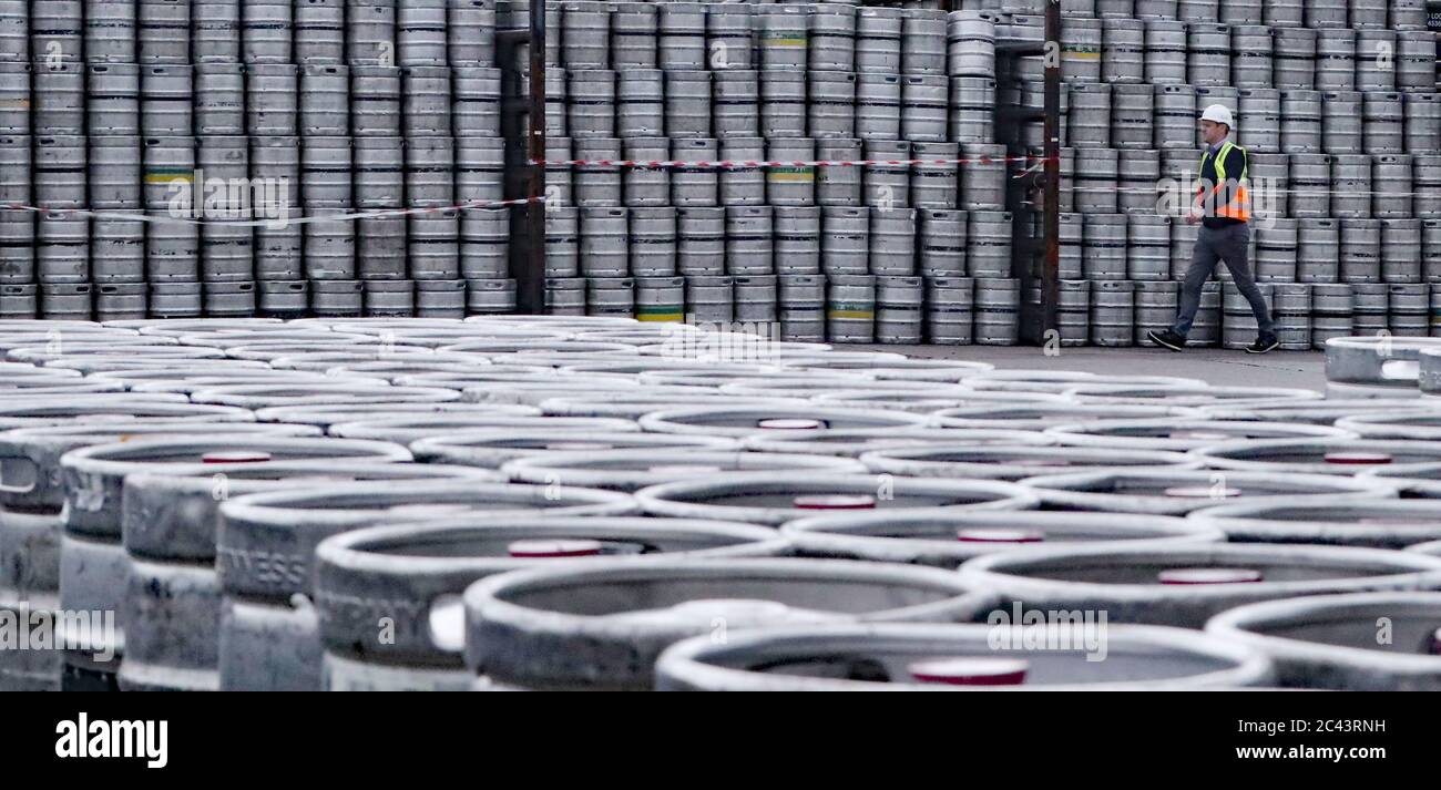 Logistics Manager Colin Griffey with kegs of Guinness stacked ready for distribution at the St James's Gate Guinness brewery in Dublin as production ramps up in preparation for bars re-opening in the UK and Ireland. Stock Photo