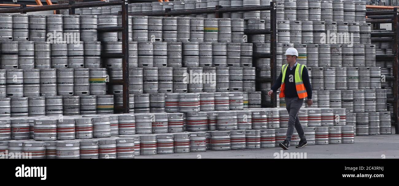 Logistics Manager Colin Griffey with kegs of Guinness stacked ready for distribution at the St James's Gate Guinness brewery in Dublin as production ramps up in preparation for bars re-opening in the UK and Ireland. Stock Photo