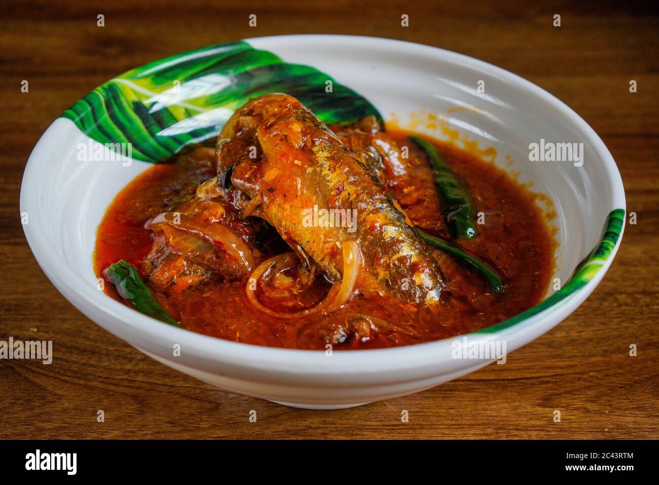 Sambal tumis sardin Sardine fish cooked with spicy sambal Stock Photo