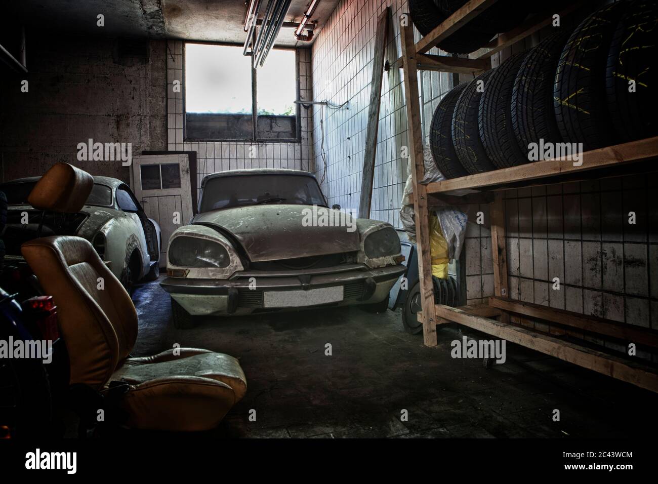 Old car dusty in a garage Stock Photo Alamy