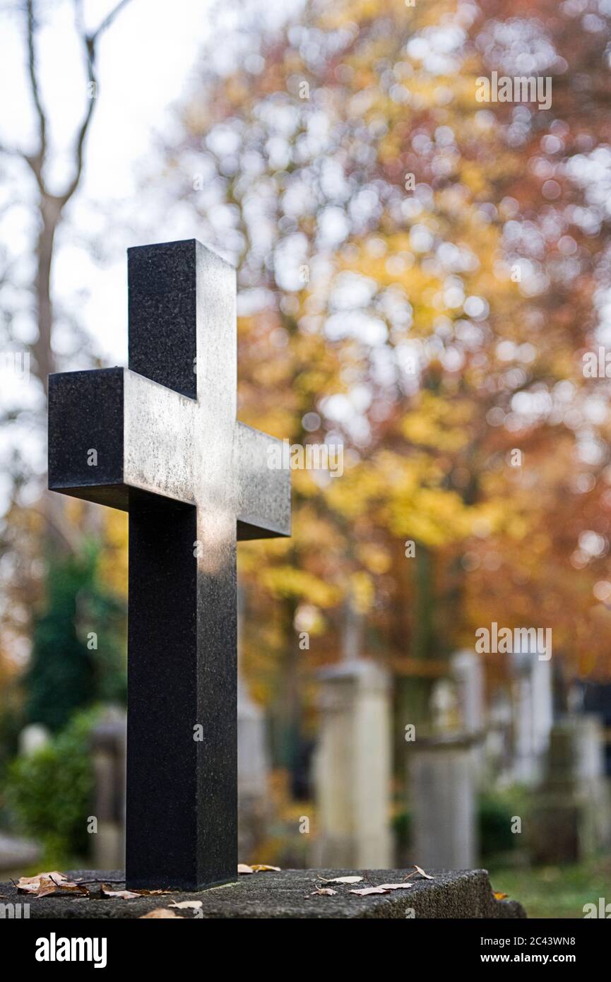 Crucifix in a cemetery, Munich, Bavaria, Germany Stock Photo