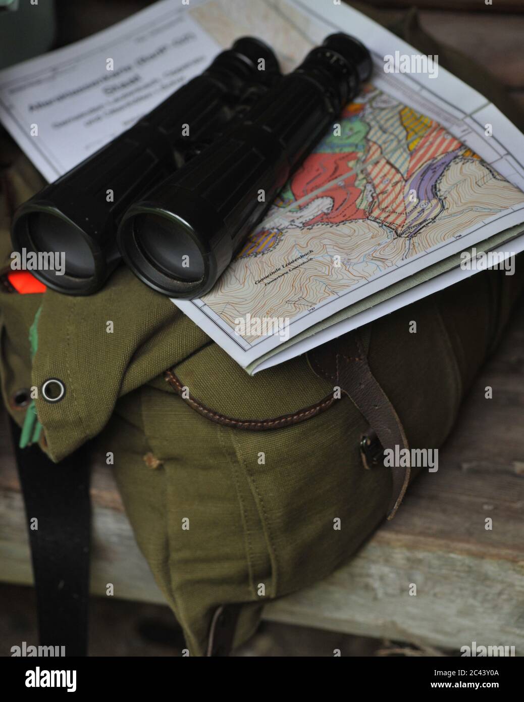 Binoculars, map and bag Stock Photo Alamy