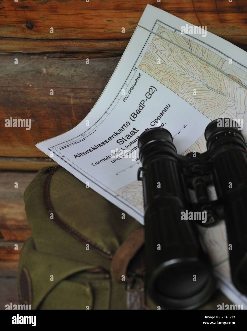 Binoculars, map and bag Stock Photo Alamy