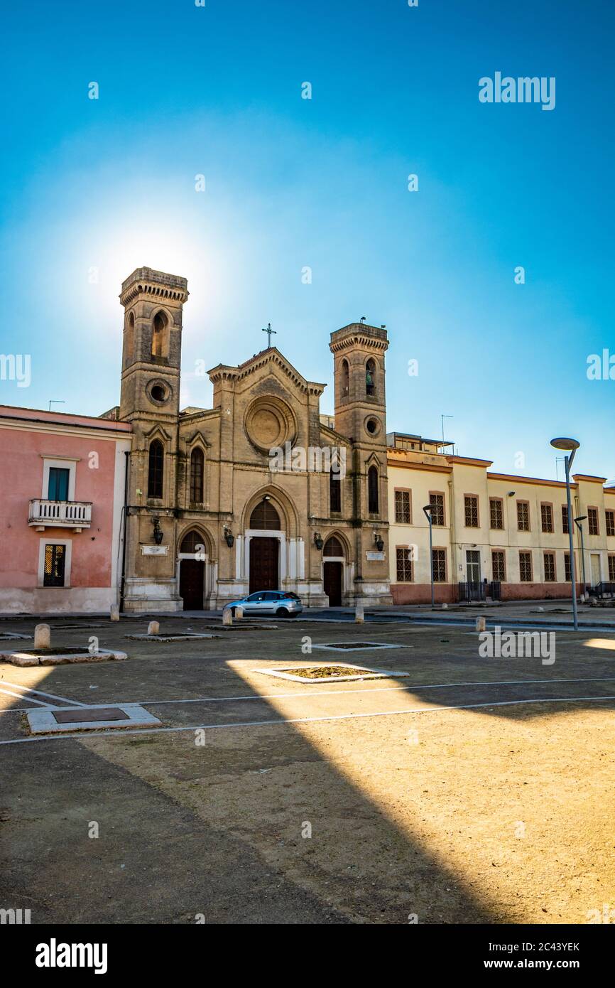 Beautiful and ancient Catholic church of San Domenico, near the plain of grain pits, Piano delle Fosse Granarie. Ancient stone silos for cereal storag Stock Photo